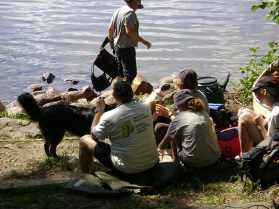 A group waits at a portage in North Tea Lake